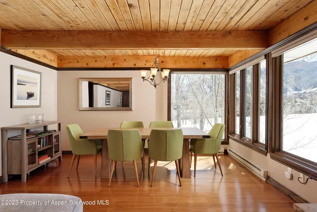 a view of a dining room with furniture window and outside view