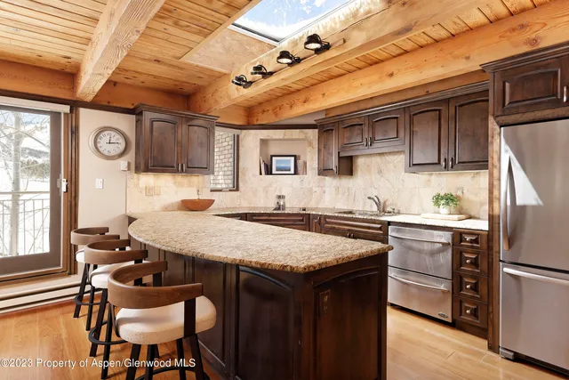 a dining table with chairs and wooden floor