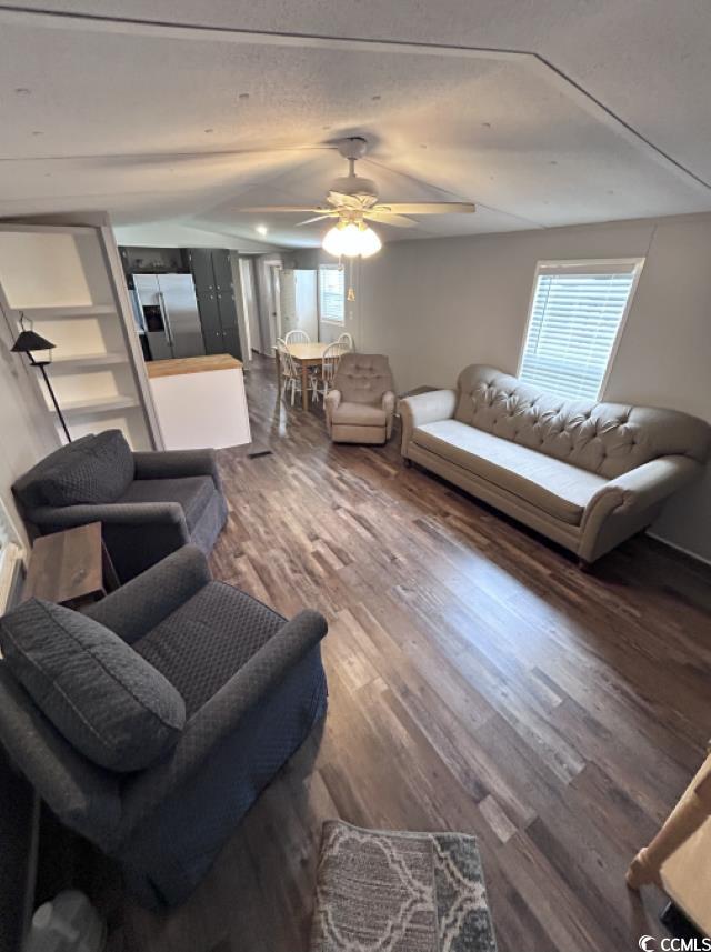 356 Calhoun Drive Murrells Inlet, SC 29576 - Photo 2 of 26 Living room featuring wood finished floors, vaulted ceiling, and ceiling fan