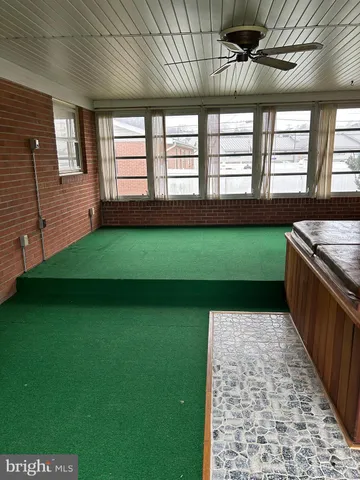 a view of a kitchen with a dishwasher and a fireplace