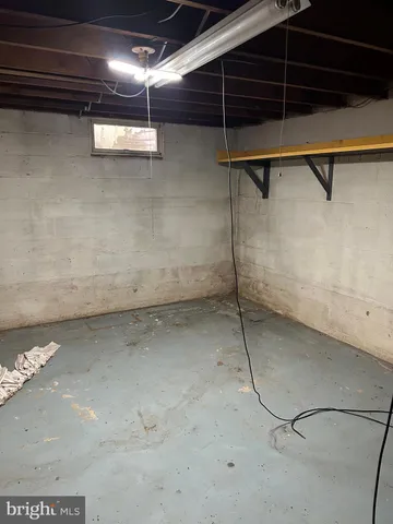 a view of an empty room with windows