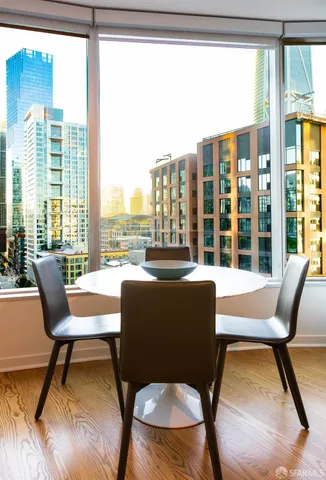 a view of a balcony with furniture and a potted plant