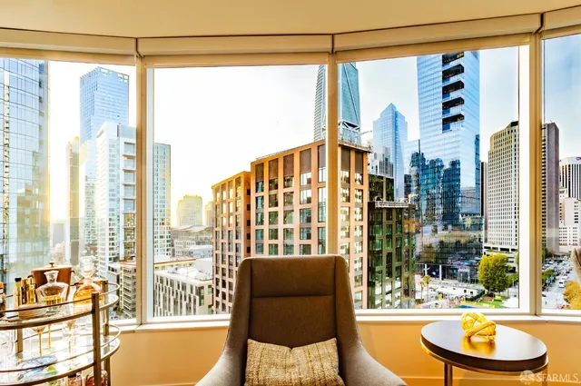 a view of a building with a umbrellas on a street