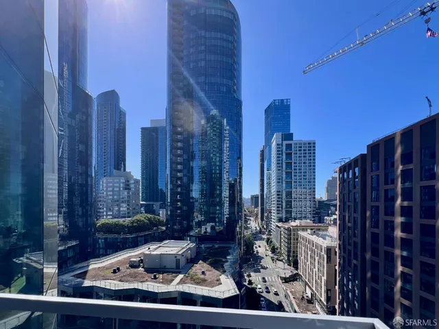 a view of a patio with couches table and chairs and potted plants