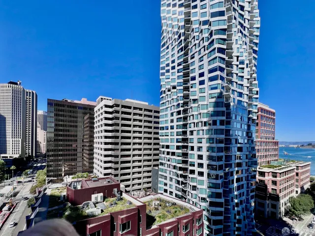 a dining room with furniture and a chandelier