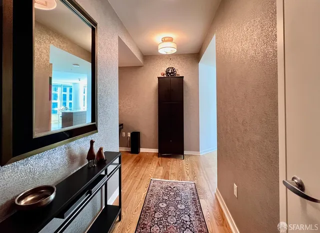 a living room with furniture window and wooden floor