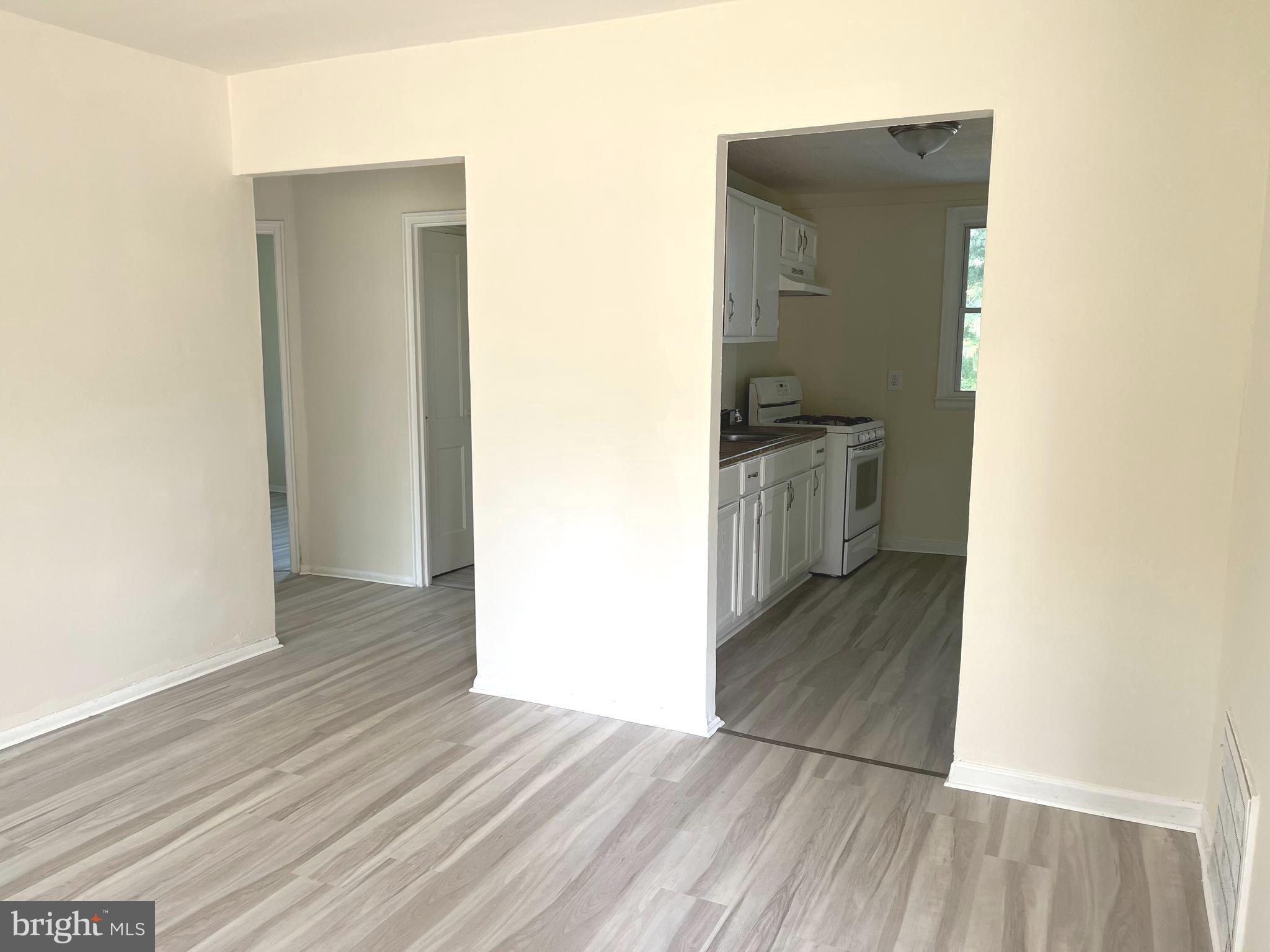 227 Kinsley Road Pemberton, NJ 08068 - Photo 4 of 18 a view of a kitchen from the hallway