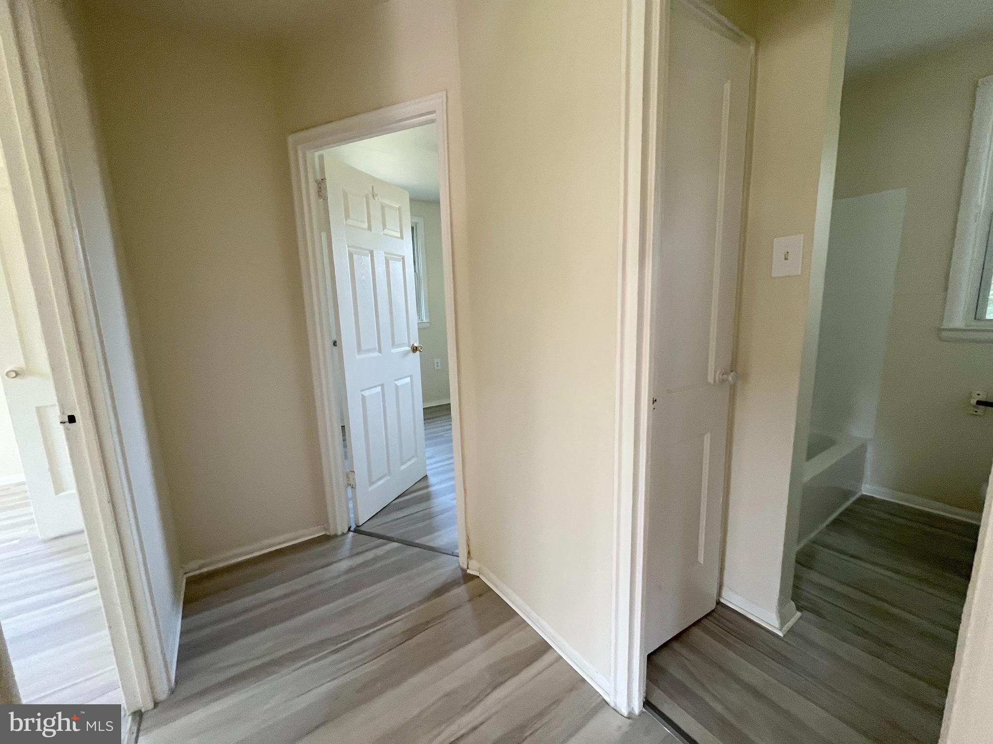 227 Kinsley Road Pemberton, NJ 08068 - Photo 8 of 18 a view of a hallway with wooden floor