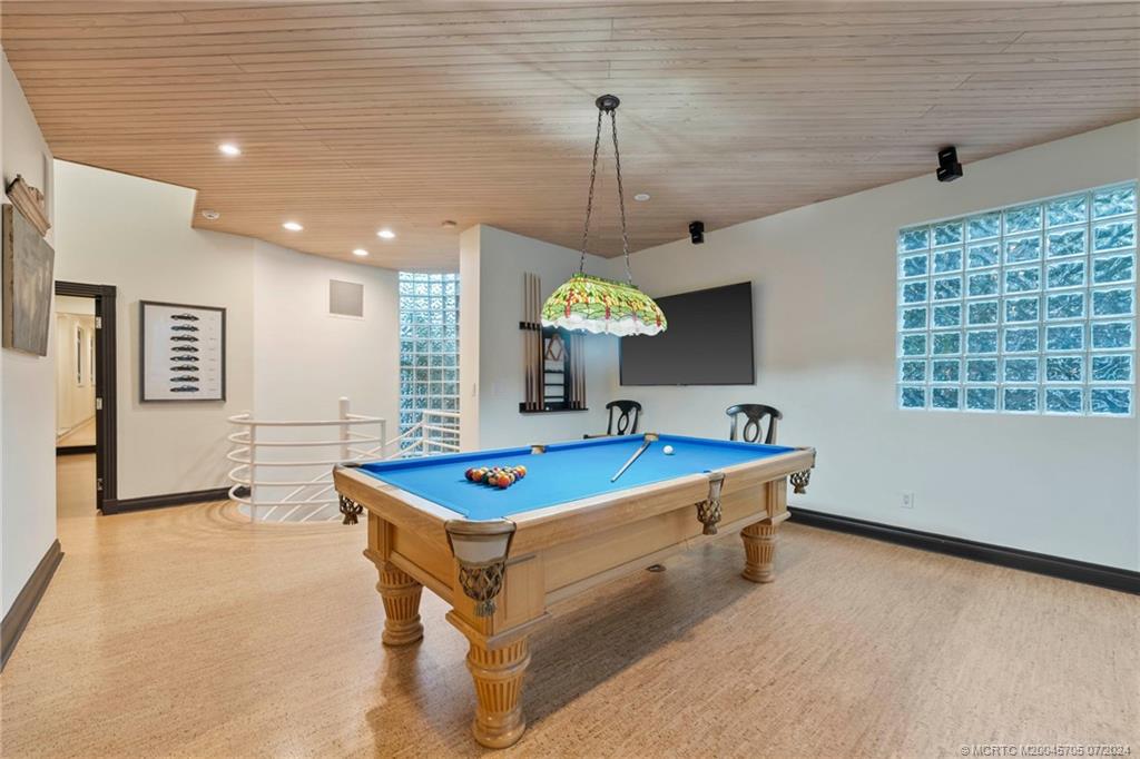 24 Ridgeland Drive Stuart, FL 34996 - Photo 67 of 99 a room with pool table and windows