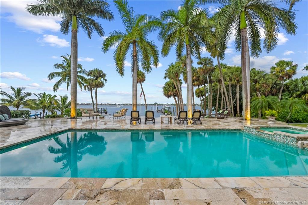 24 Ridgeland Drive Stuart, FL 34996 - Photo 82 of 99 a view of swimming pool with a garden