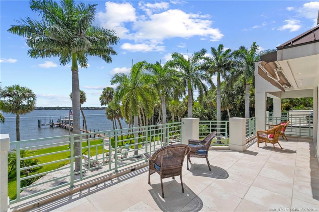 24 Ridgeland Drive Stuart, FL 34996 - Photo 90 of 99 a view of a chairs and table in the patio