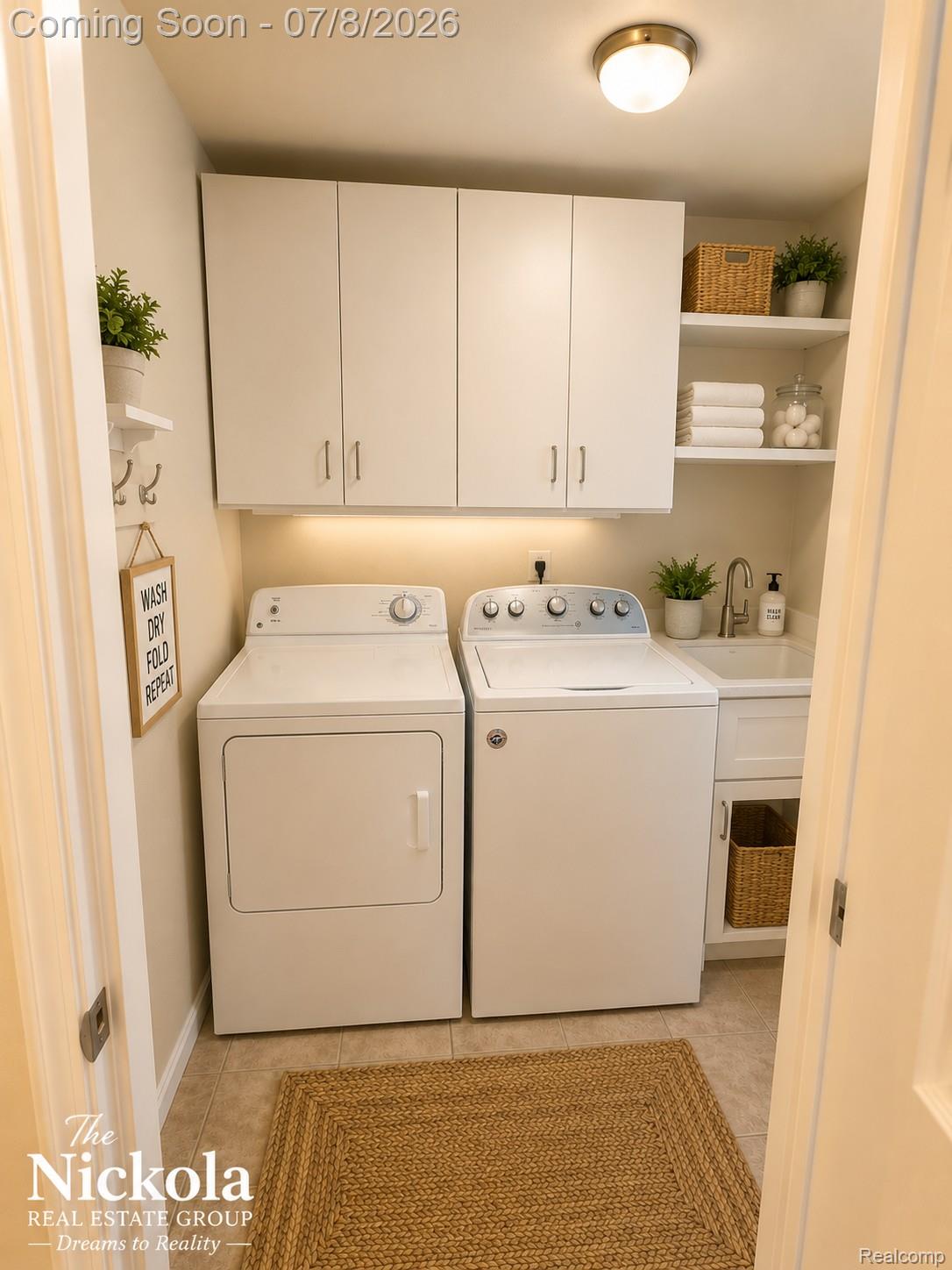 414 Whitney Drive Rochester, MI 48307 - Photo 15 of 30 Dedicated laundry area featuring a tile floor, built-in white cabinetry, open shelving, a utility sink, and under-cabinet lighting