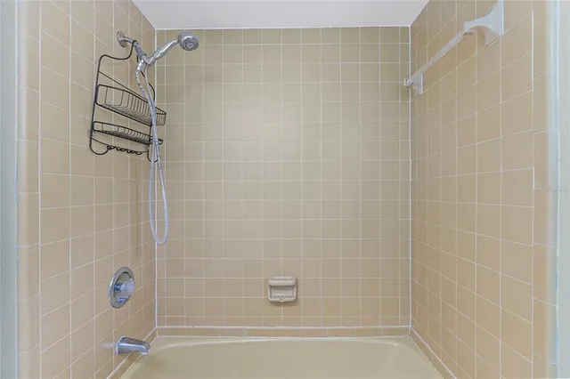 a bathroom with a shower and a bathtub