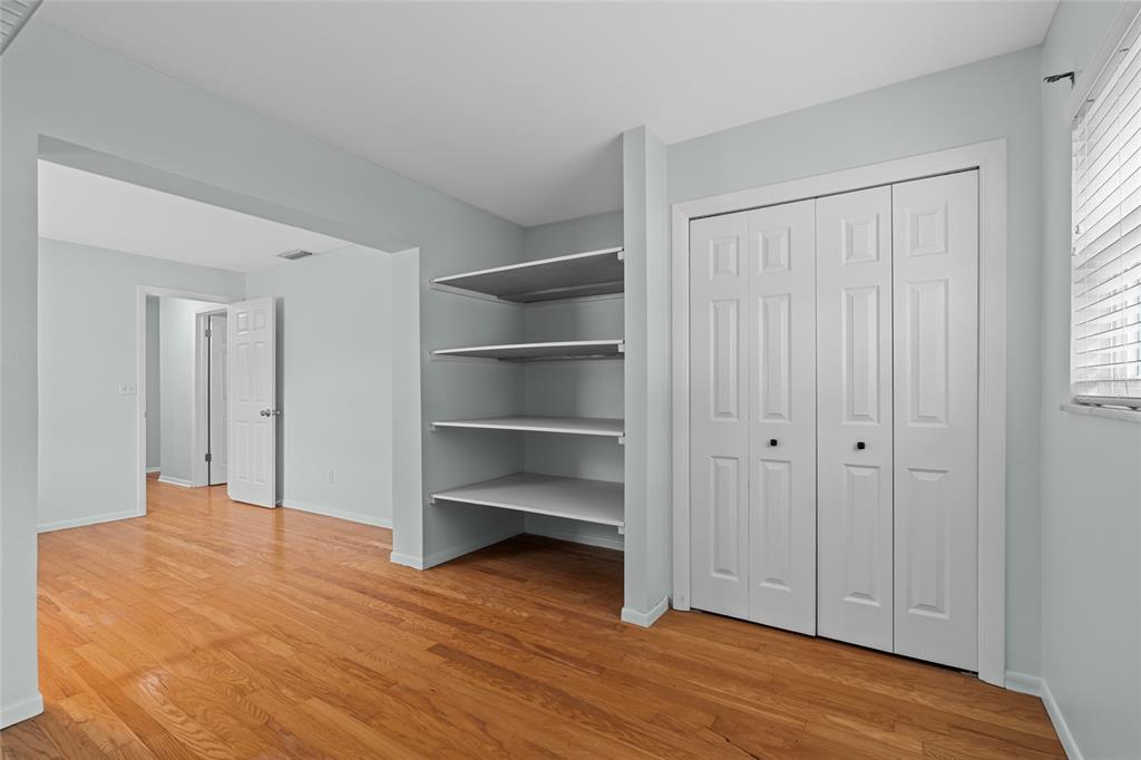13236 84th Terrace Seminole, FL 33776 - Photo 24 of 34 a view of empty room with wooden floor and fan