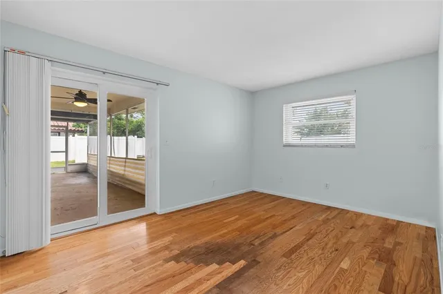 a view of an empty room with glass door