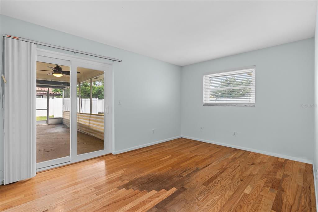 13236 84th Terrace Seminole, FL 33776 - Photo 26 of 34 a view of an empty room with glass door