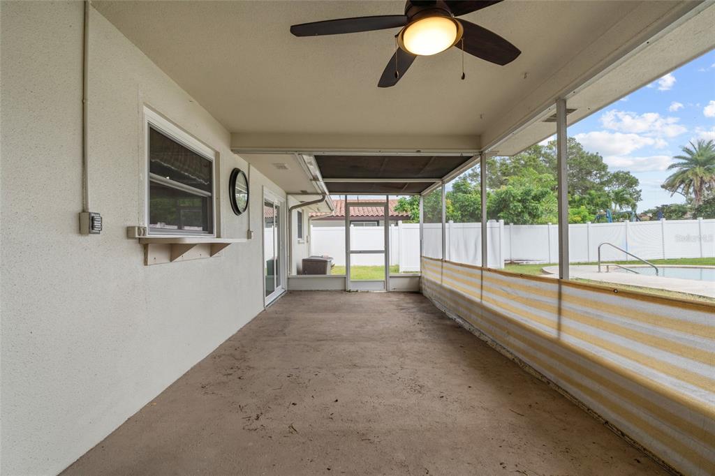 13236 84th Terrace Seminole, FL 33776 - Photo 29 of 34 a view of a living room hardwood floor and chandelier