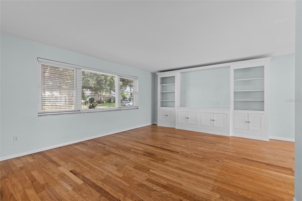13236 84th Terrace Seminole, FL 33776 - Photo 5 of 34 a view of empty room with wooden floor and fan