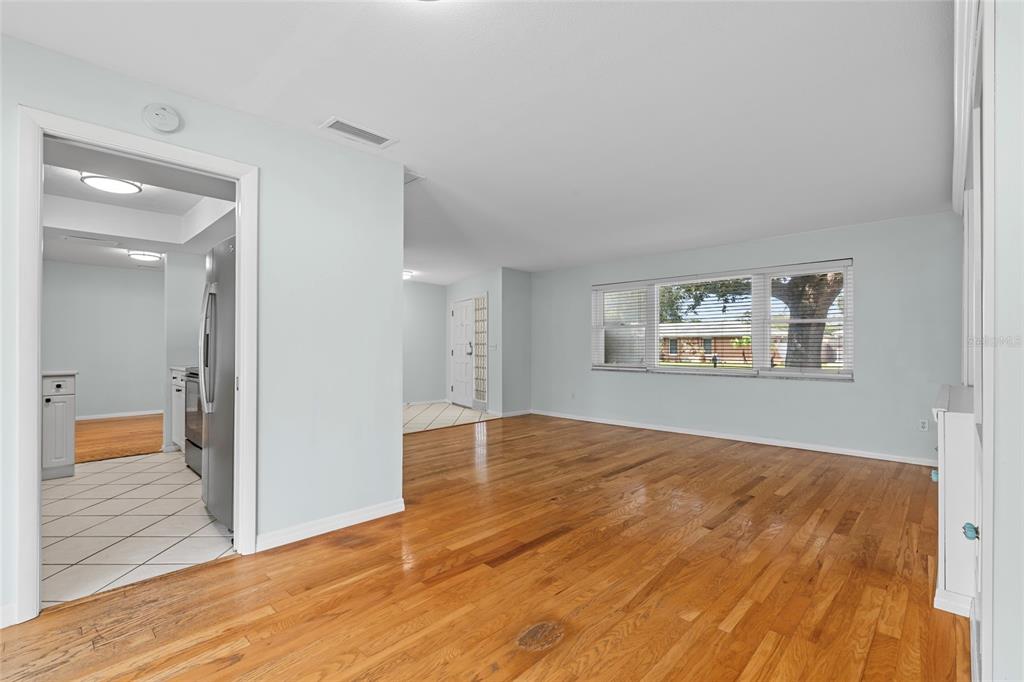 13236 84th Terrace Seminole, FL 33776 - Photo 7 of 34 a view of empty room with wooden floor