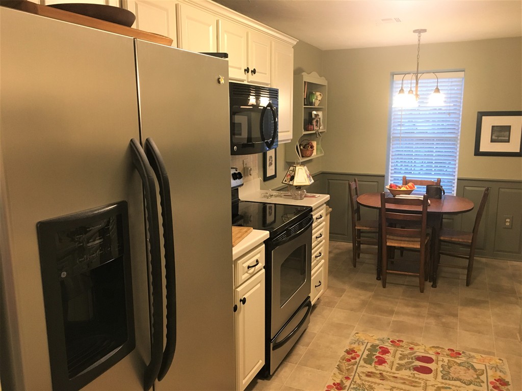 703 Ridgefield Circle, Unit A Clinton, MA 01510 - Photo 3 of 13 a kitchen with stainless steel appliances granite countertop a refrigerator and a stove