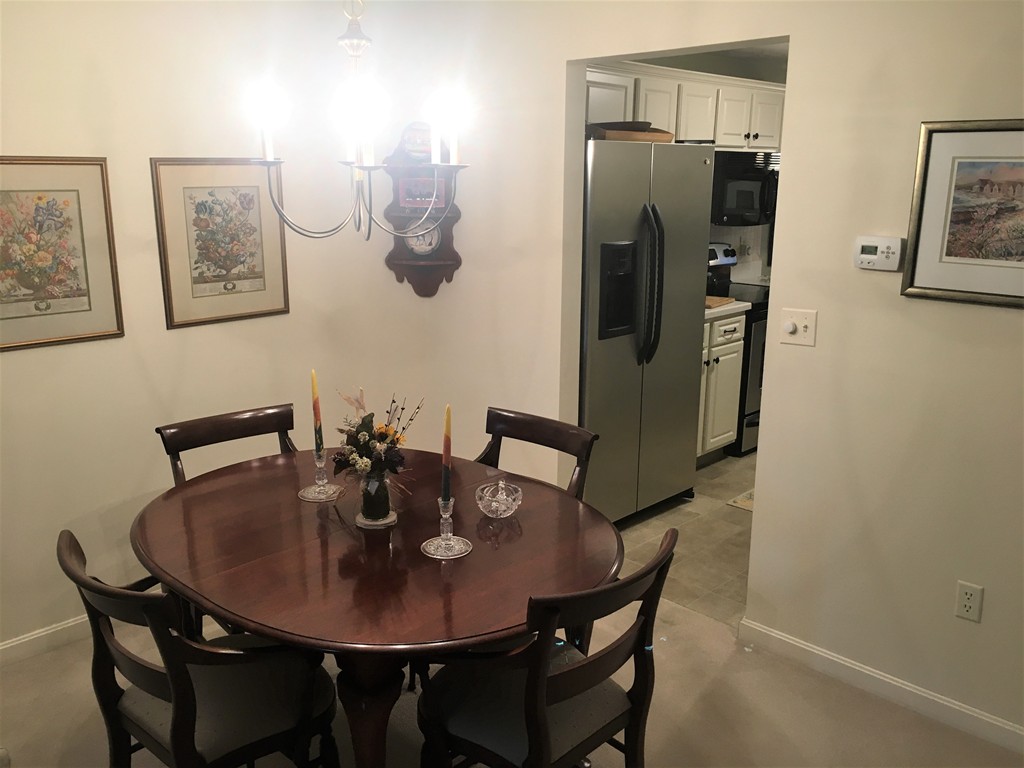 703 Ridgefield Circle, Unit A Clinton, MA 01510 - Photo 4 of 13 a view of a dining room with furniture