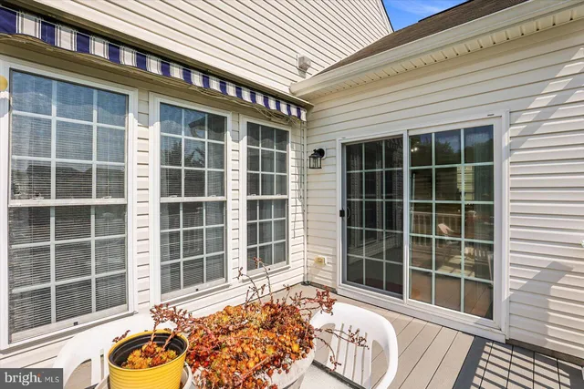 a front view of a house with a large window