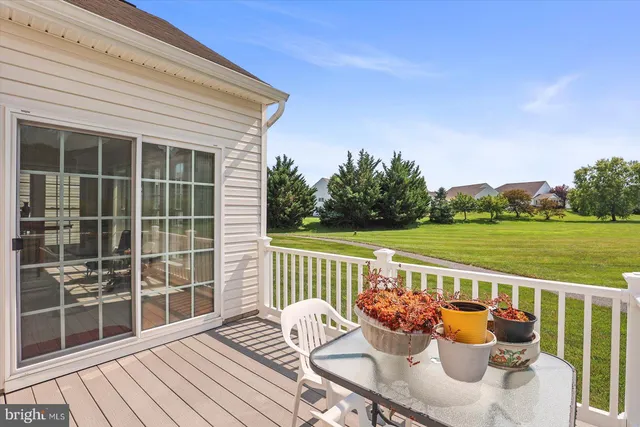 a outdoor view with a sitting space and garden