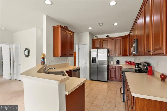 a kitchen with refrigerator cabinets and furniture