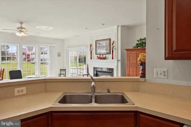a kitchen with a sink and a window