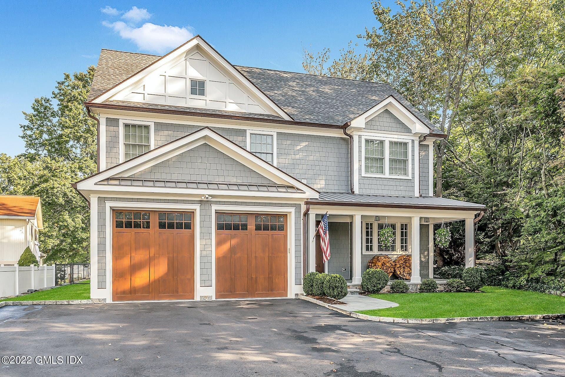 24 Neil Lane Riverside, CT 06878 - Photo 1 of 36 a front view of a house with a yard