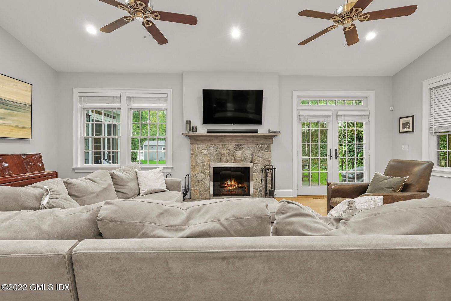 24 Neil Lane Riverside, CT 06878 - Photo 11 of 36 a living room with furniture or fireplace and a flat screen tv