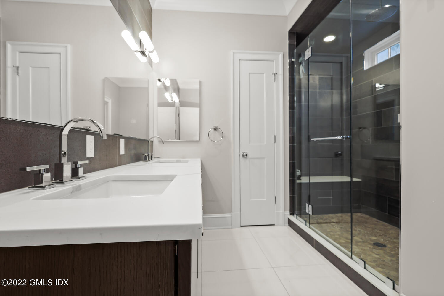 24 Neil Lane Riverside, CT 06878 - Photo 19 of 36 a bathroom with a sink shower and a mirror