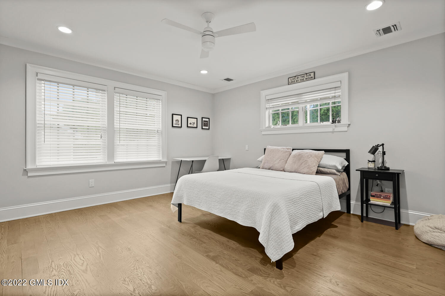 24 Neil Lane Riverside, CT 06878 - Photo 21 of 36 a spacious bedroom with a bed and a table in it