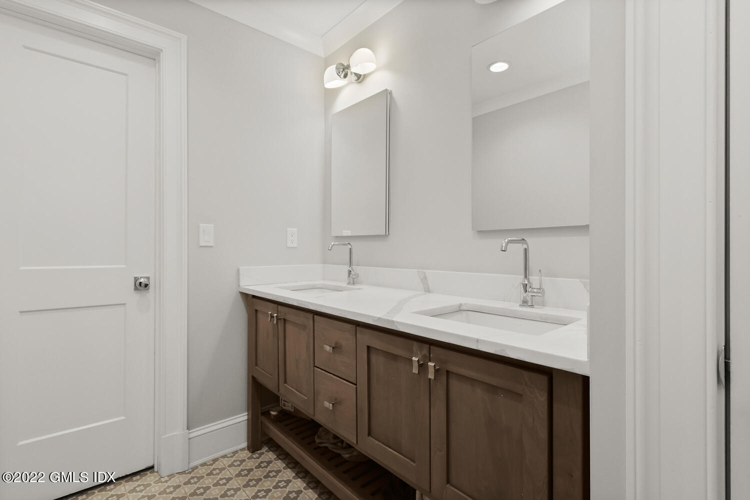 24 Neil Lane Riverside, CT 06878 - Photo 24 of 36 a bathroom with a double vanity sink and a mirror