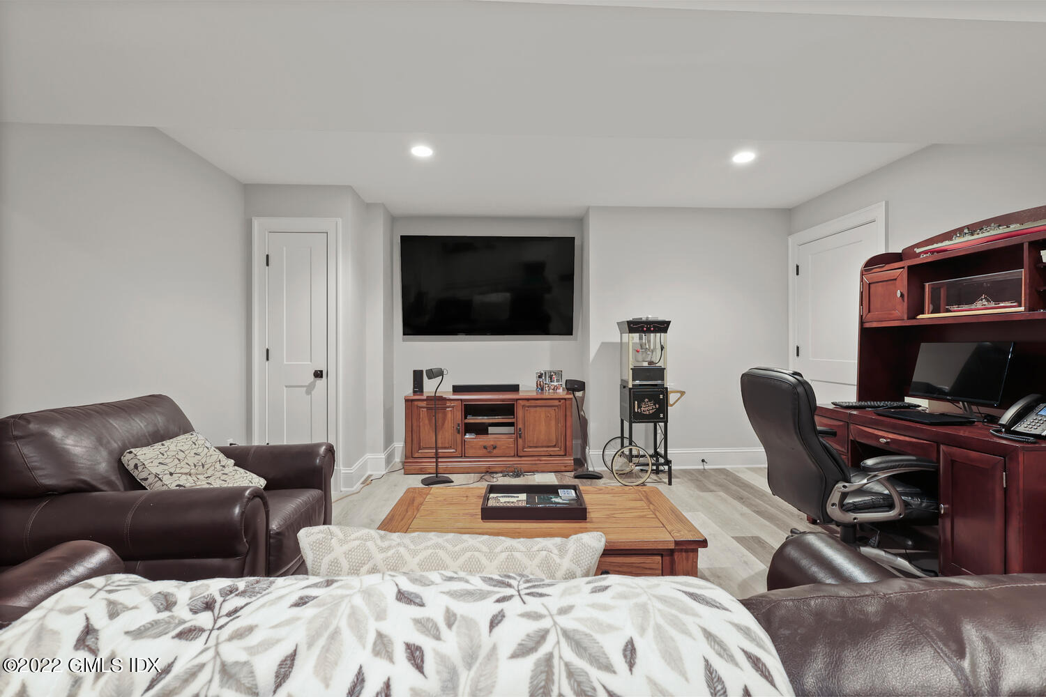 24 Neil Lane Riverside, CT 06878 - Photo 29 of 36 a bedroom with furniture and a flat screen tv