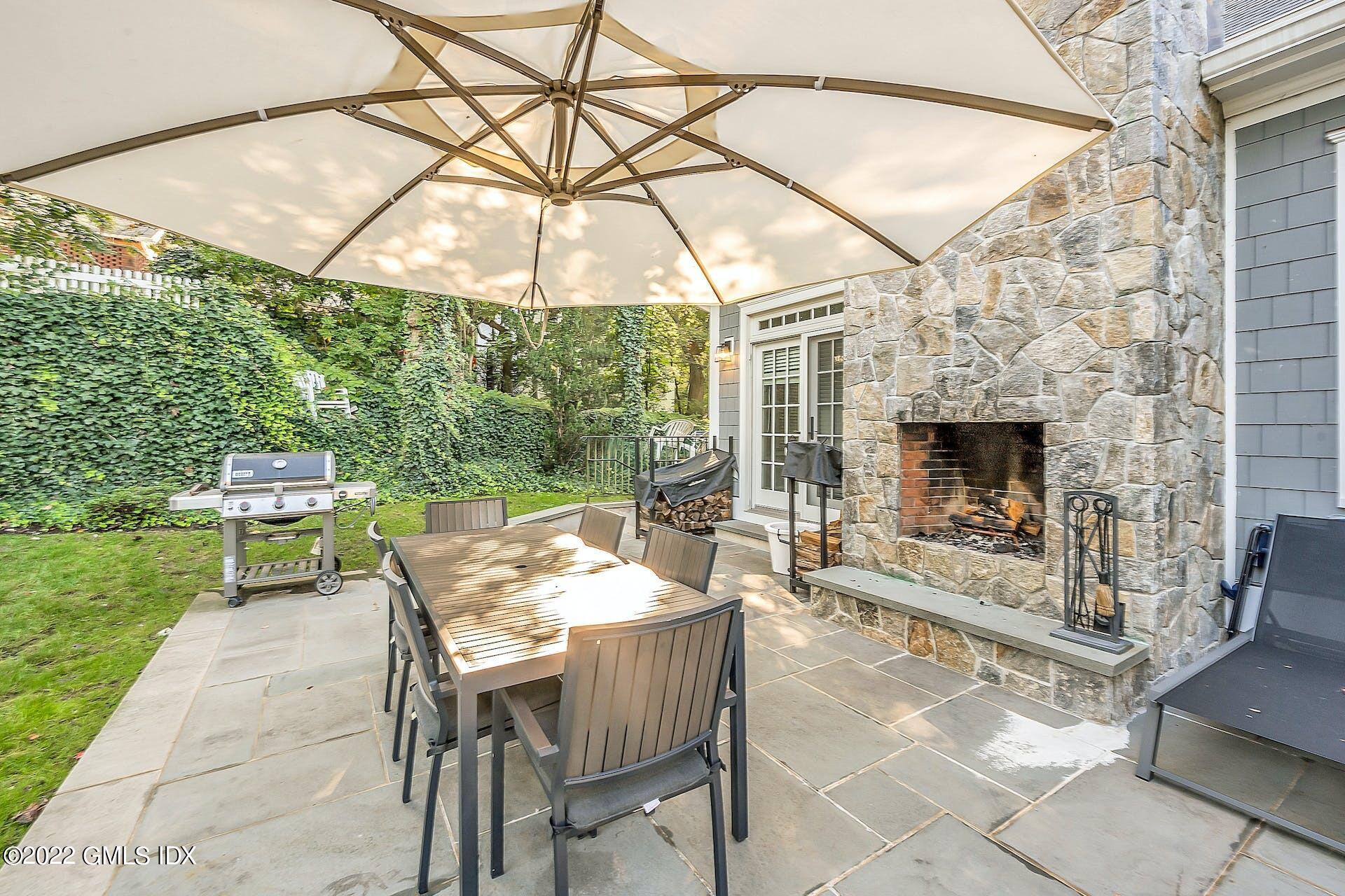 24 Neil Lane Riverside, CT 06878 - Photo 34 of 36 a outdoor space with a fireplace