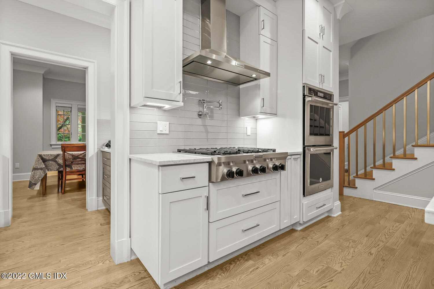 24 Neil Lane Riverside, CT 06878 - Photo 6 of 36 a kitchen with white cabinets and appliances