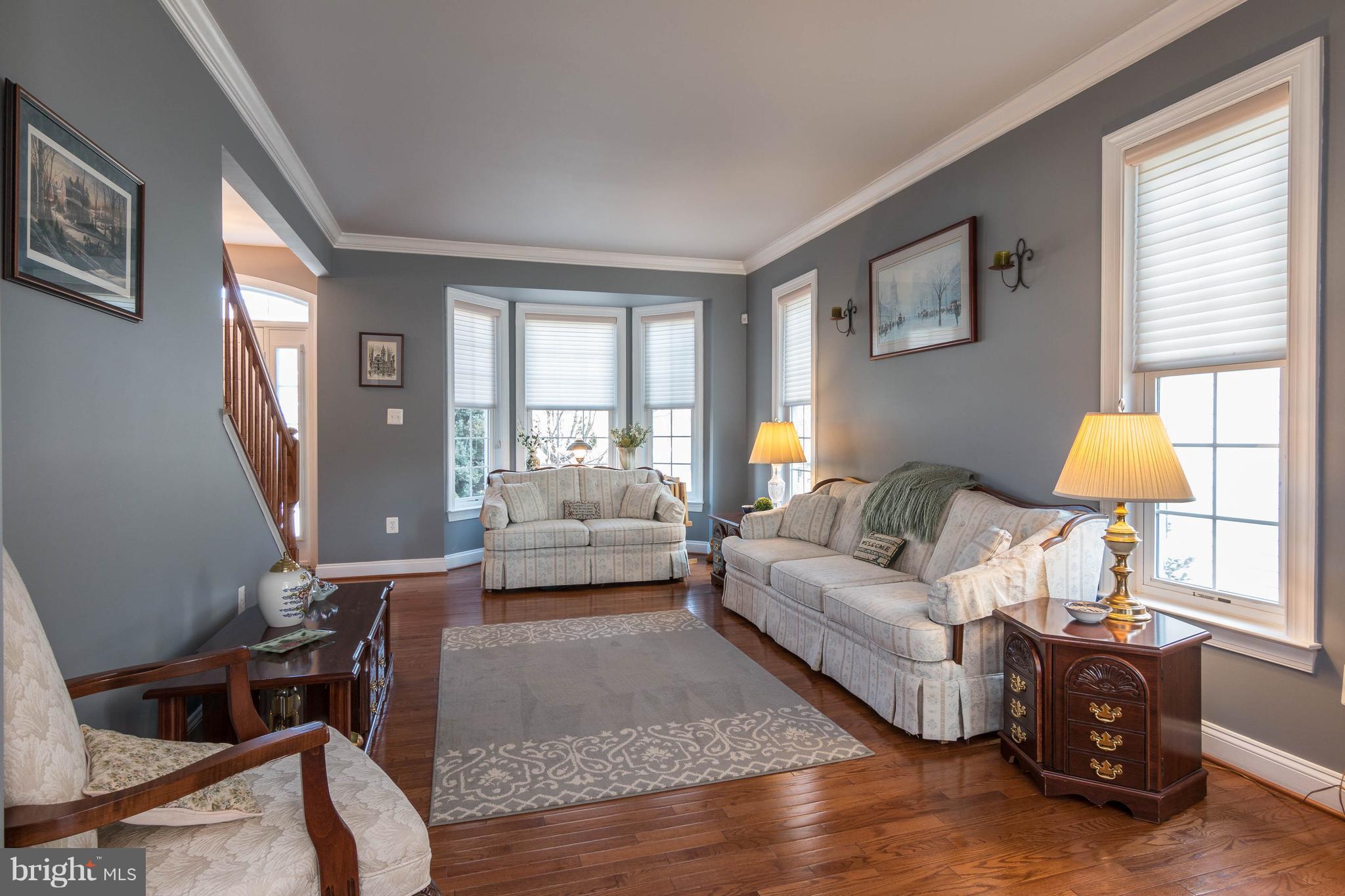 8316 Academy Road Ellicott City, MD 21043 - Photo 4 of 30 Fresh Paint, crown molding, and bay window!