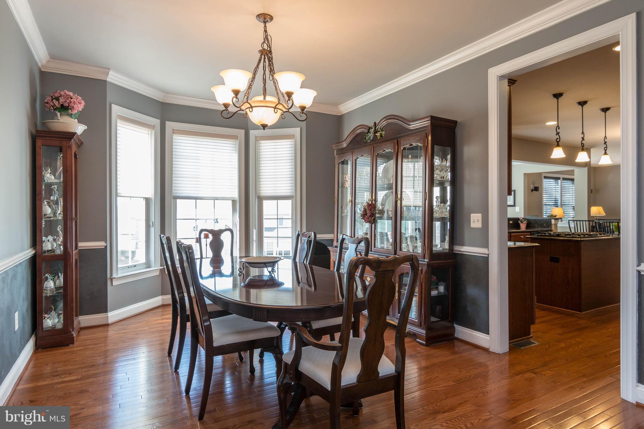 8316 Academy Road Ellicott City, MD 21043 - Photo 5 of 30 Dining Room w/ chair rail & crown molding