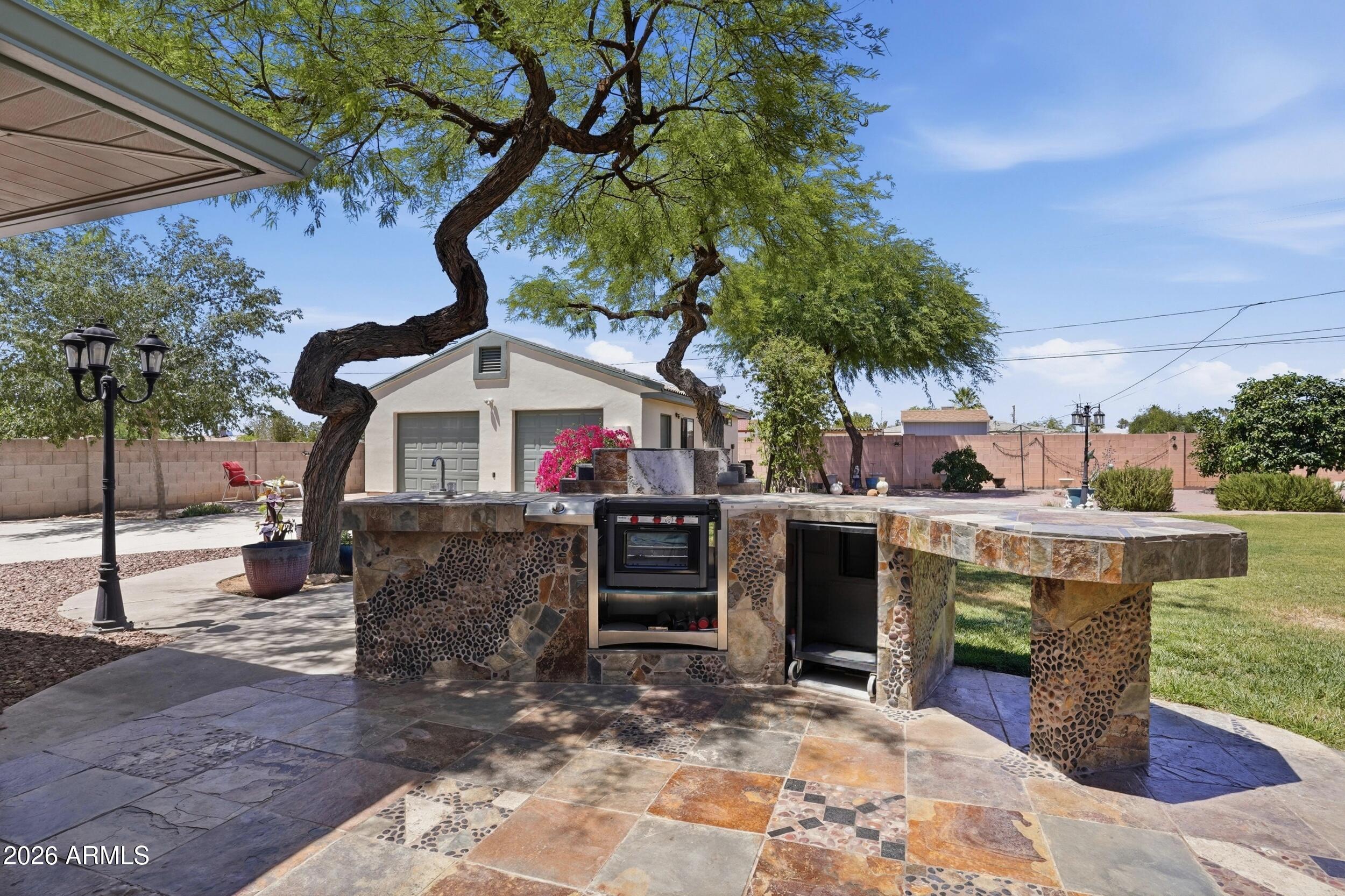 6334 East Albany Street Mesa, AZ 85205 - Photo 44 of 72 a view of a chairs and table in the patio