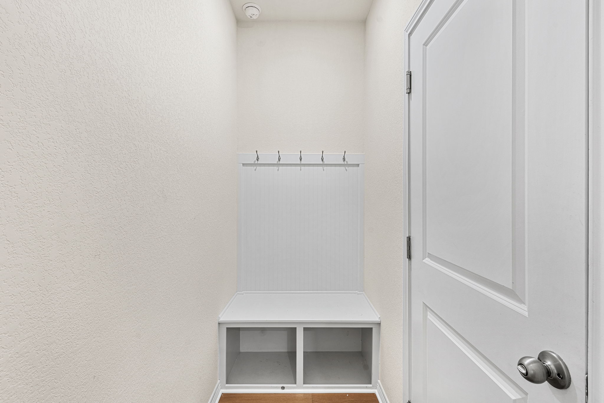 20813 Carries Ranch Road Pflugerville, TX 78660 - Photo 30 of 40 A dedicated drop zone features a built-in bench with cubbies and upper hanging hooks.