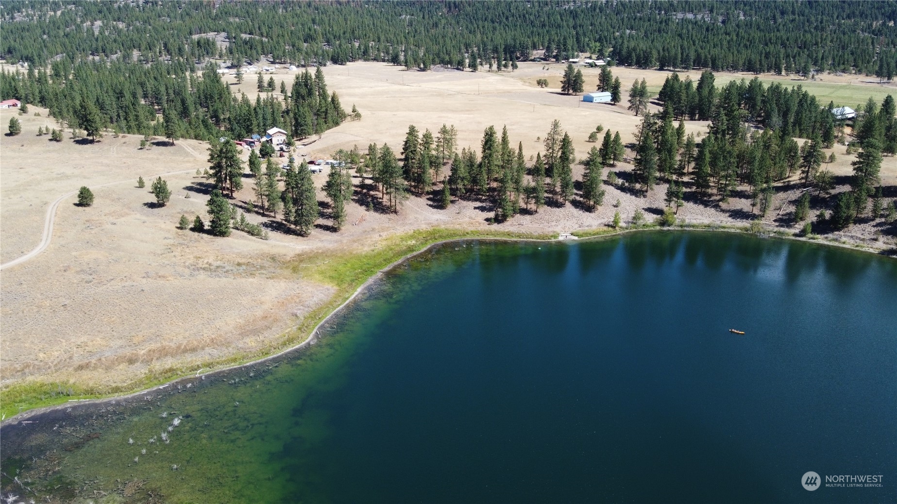 16 King Road Tonasket, WA 98855 - Photo 1 of 34 a view of a lake with houses