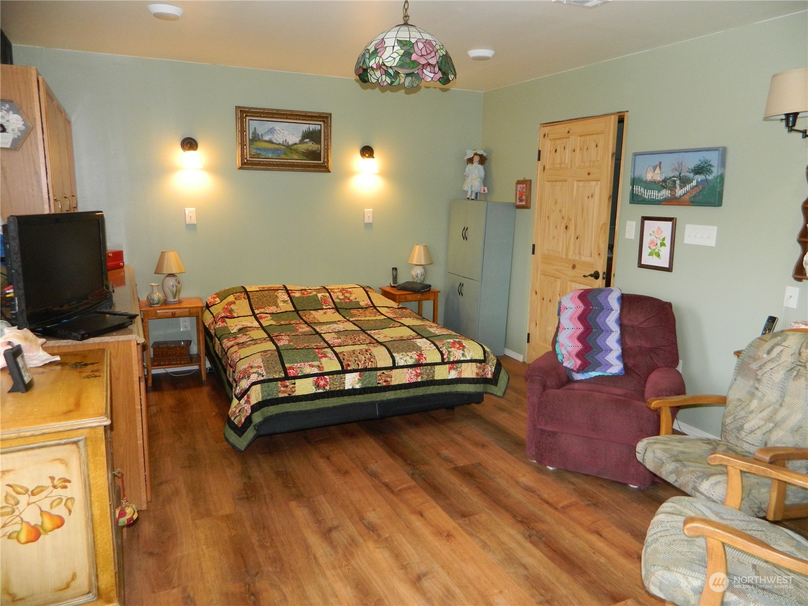 16 King Road Tonasket, WA 98855 - Photo 23 of 34 a bedroom with a bed and wooden floor