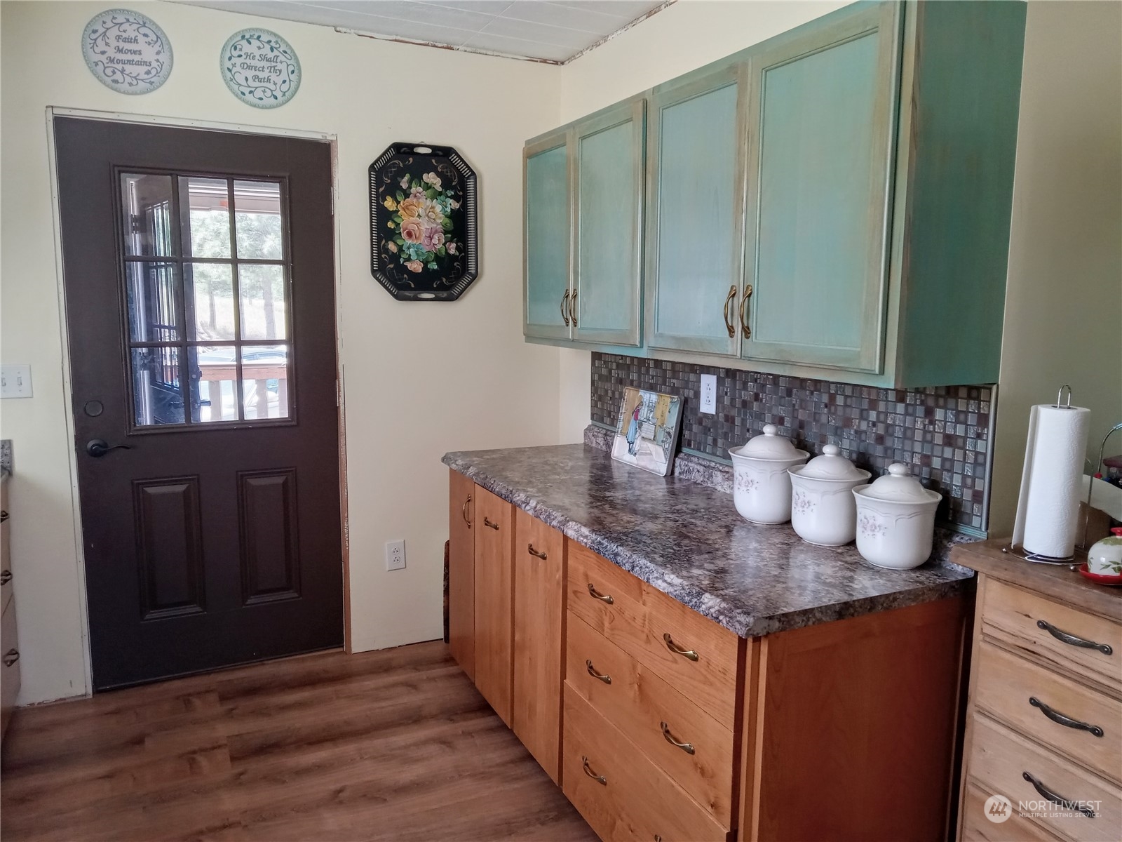 16 King Road Tonasket, WA 98855 - Photo 29 of 34 a kitchen with granite countertop a sink and cabinets