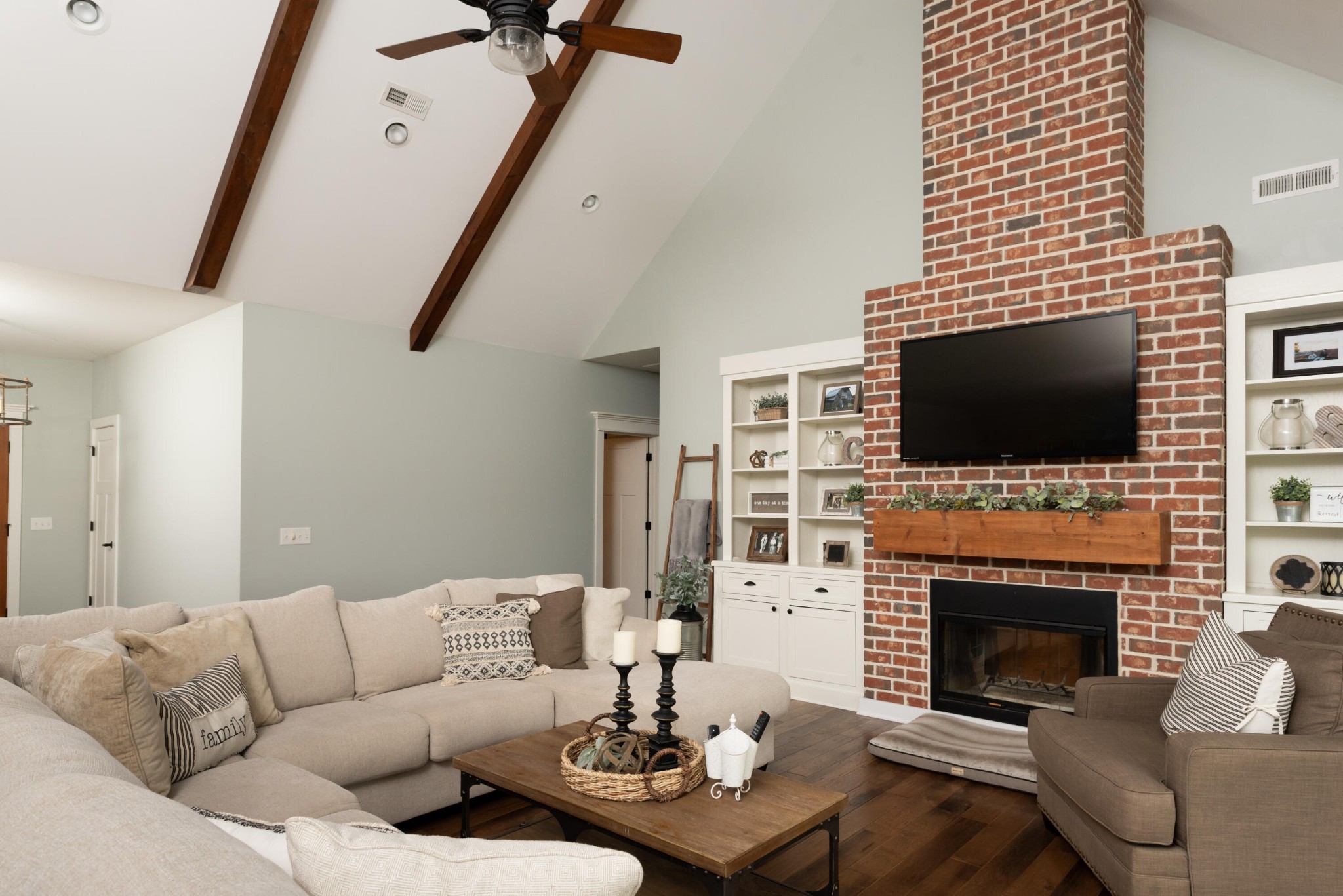 6925 Spring Place Road Southeast Old Fort, TN 37362 - Photo 19 of 46 a living room with furniture a flat screen tv and a fireplace