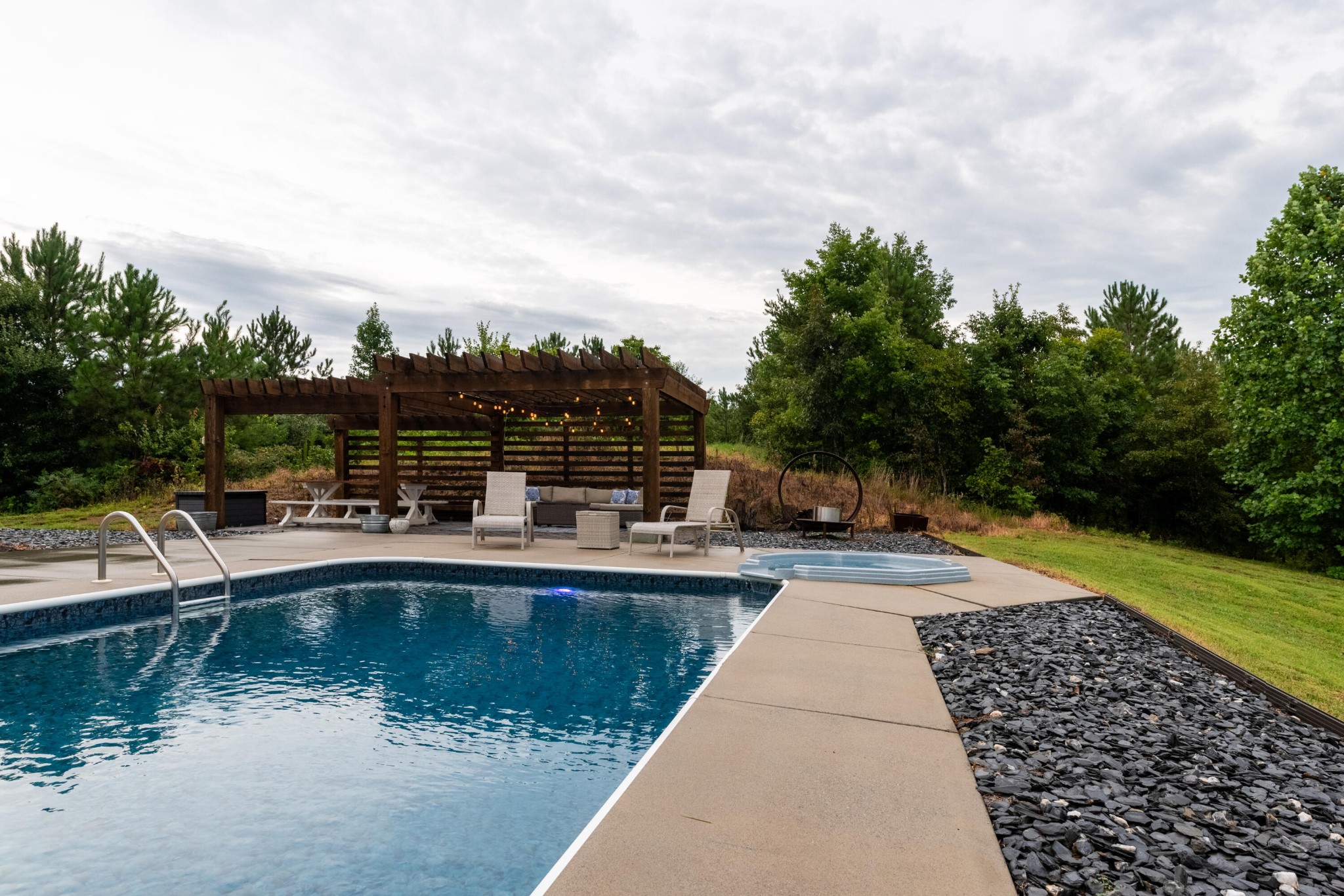 6925 Spring Place Road Southeast Old Fort, TN 37362 - Photo 40 of 46 a view of swimming pool with seating space and trees in the background