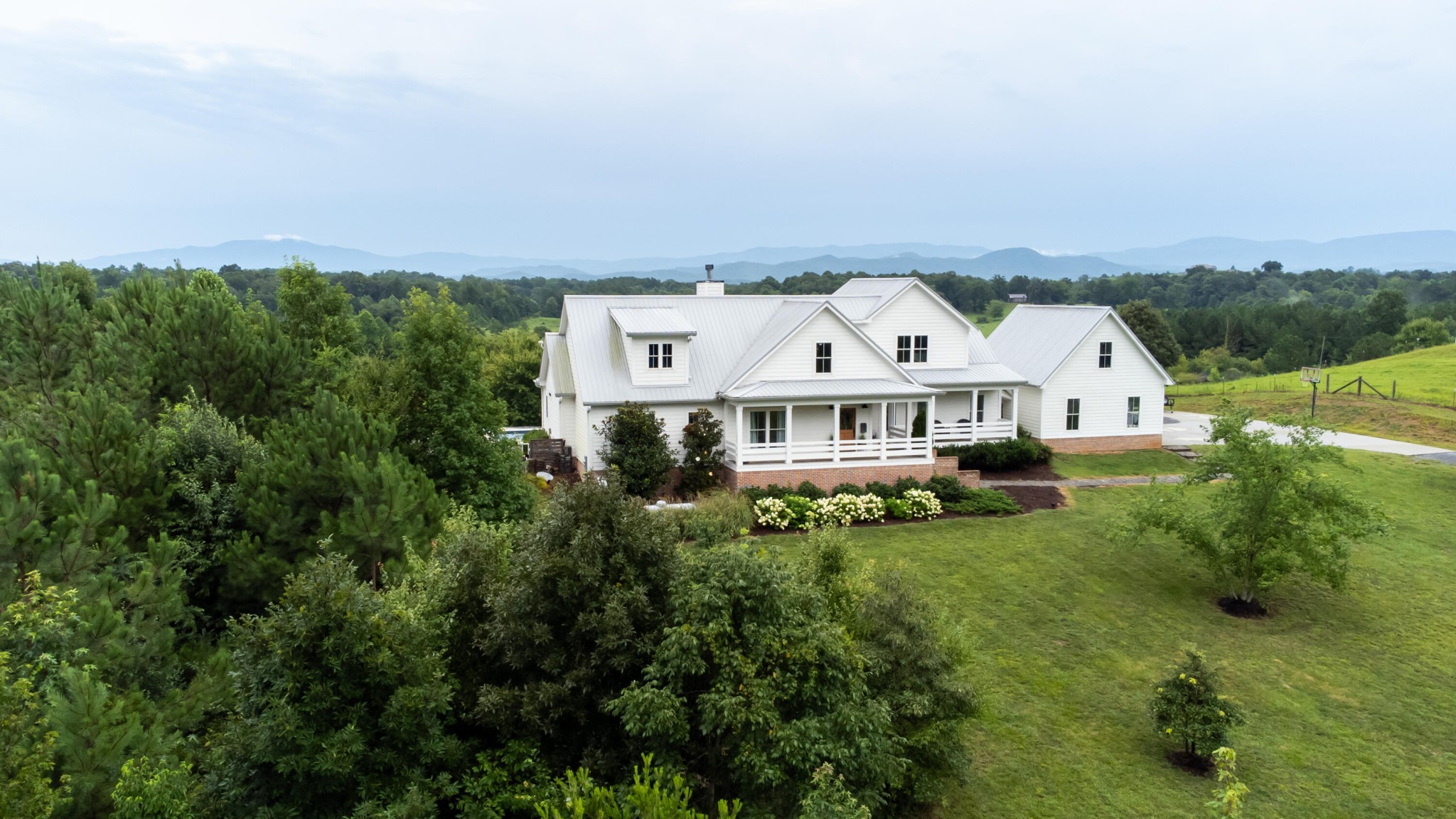 6925 Spring Place Road Southeast Old Fort, TN 37362 - Photo 5 of 46 an aerial view of a house with a big yard