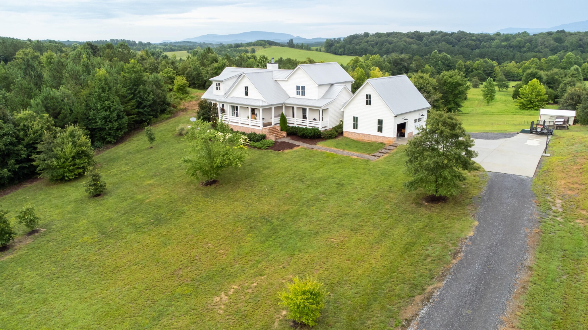 6925 Spring Place Road Southeast Old Fort, TN 37362 - Photo 7 of 46 an aerial view of a house with a garden