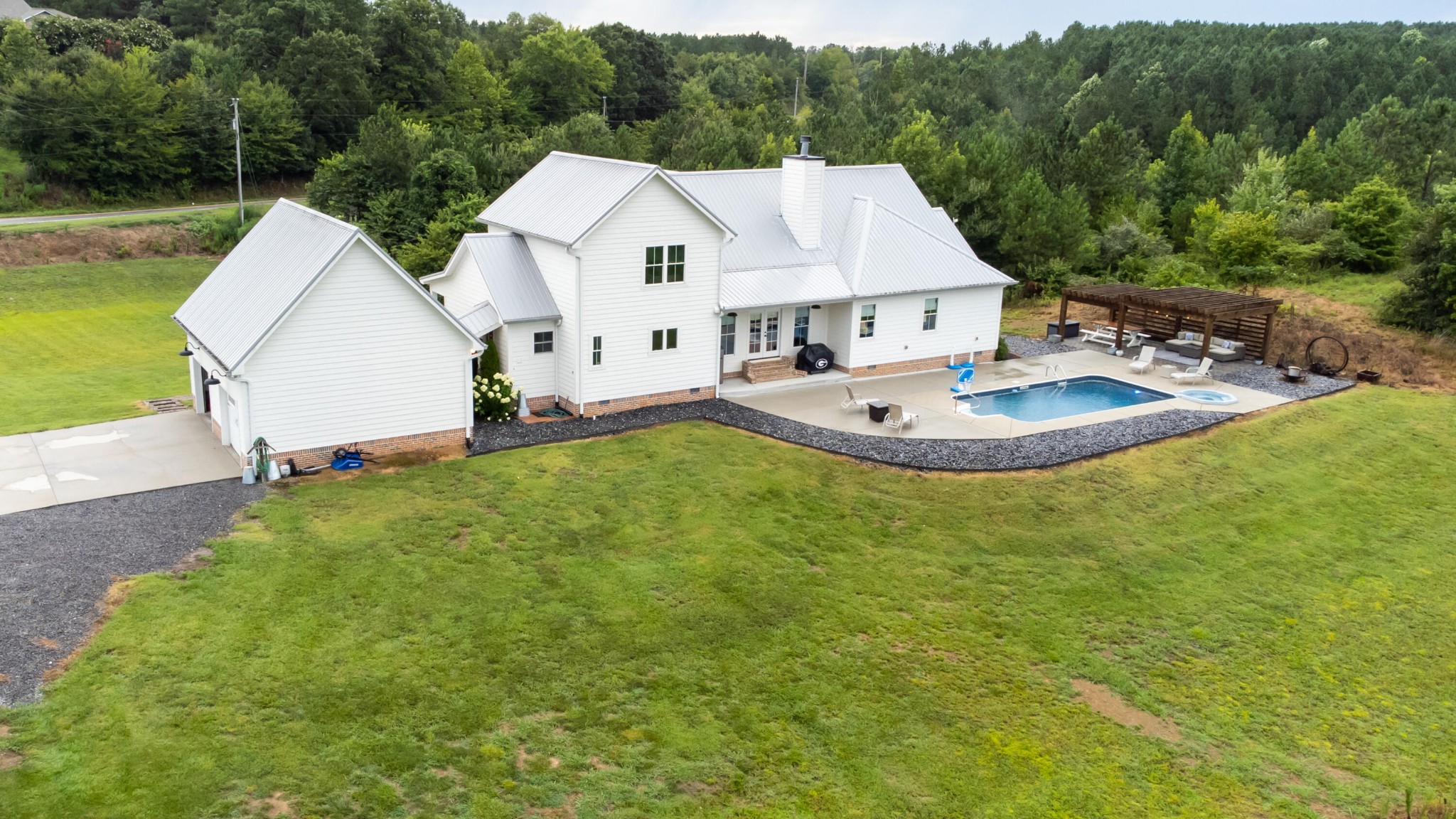 6925 Spring Place Road Southeast Old Fort, TN 37362 - Photo 8 of 46 a view of a house with pool and a yard