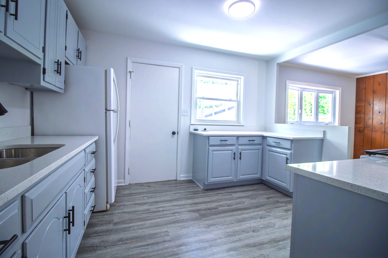 2602 Fairway Drive Joliet, IL 60435 - Photo 12 of 43 a kitchen with a sink dishwasher a stove and a refrigerator with wooden floor